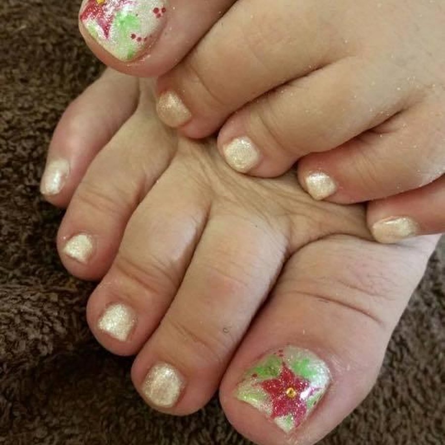 Spa pedicure with glitter and hand-painted star accent toe nail art in OKC