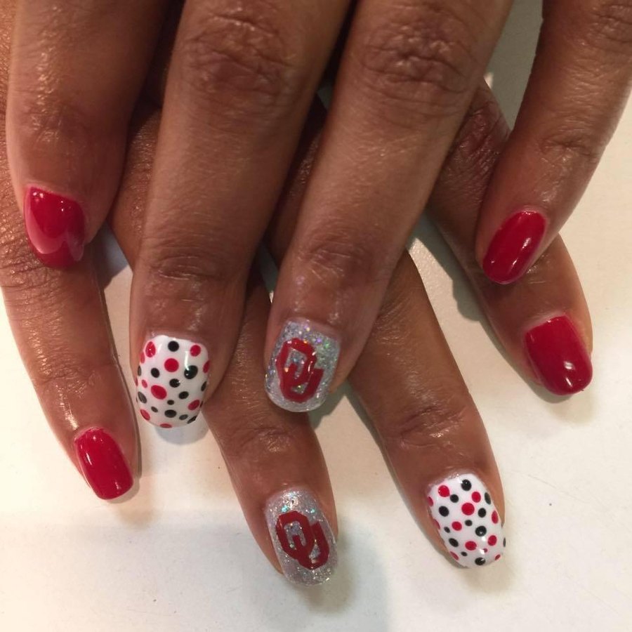 Red dip powder manicure with silver glitter and dot accent nails, Oklahoma City nail art
